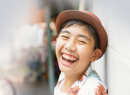 Boy with braces at school